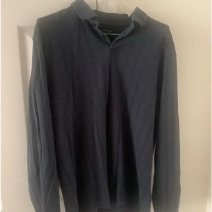 Blueish gray in color. Colored shirt. Long sleeve.